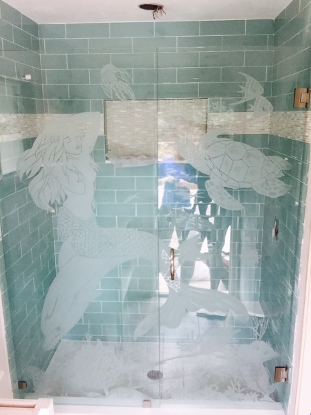 beautiful custom etched glass shower enclosure with glass door